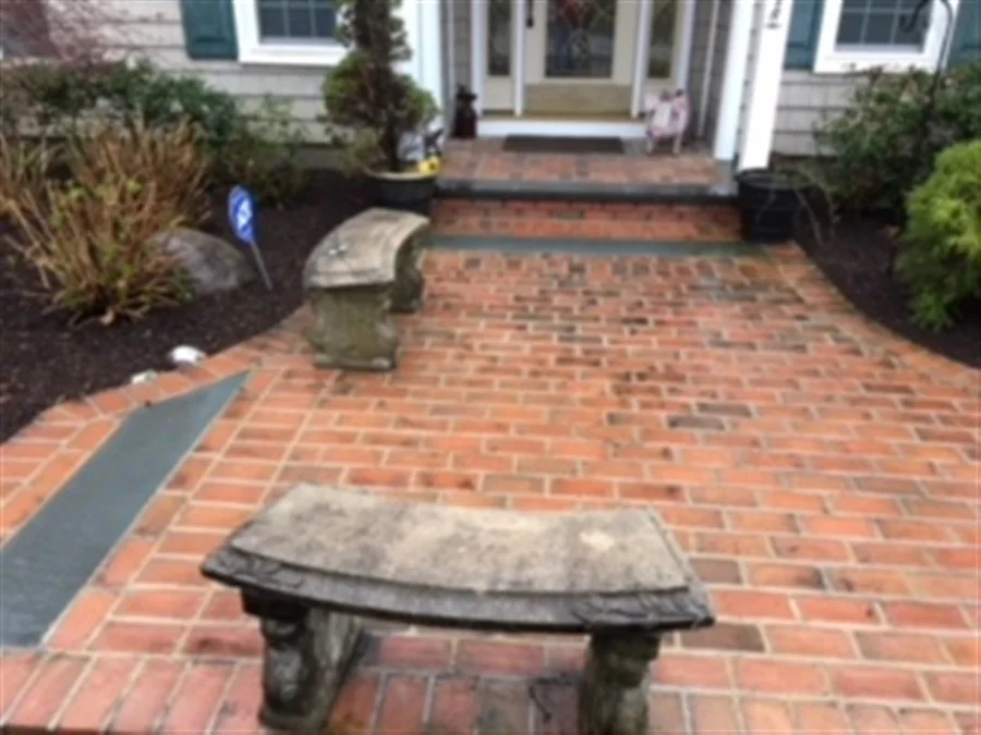 stone bench and brick front walkway