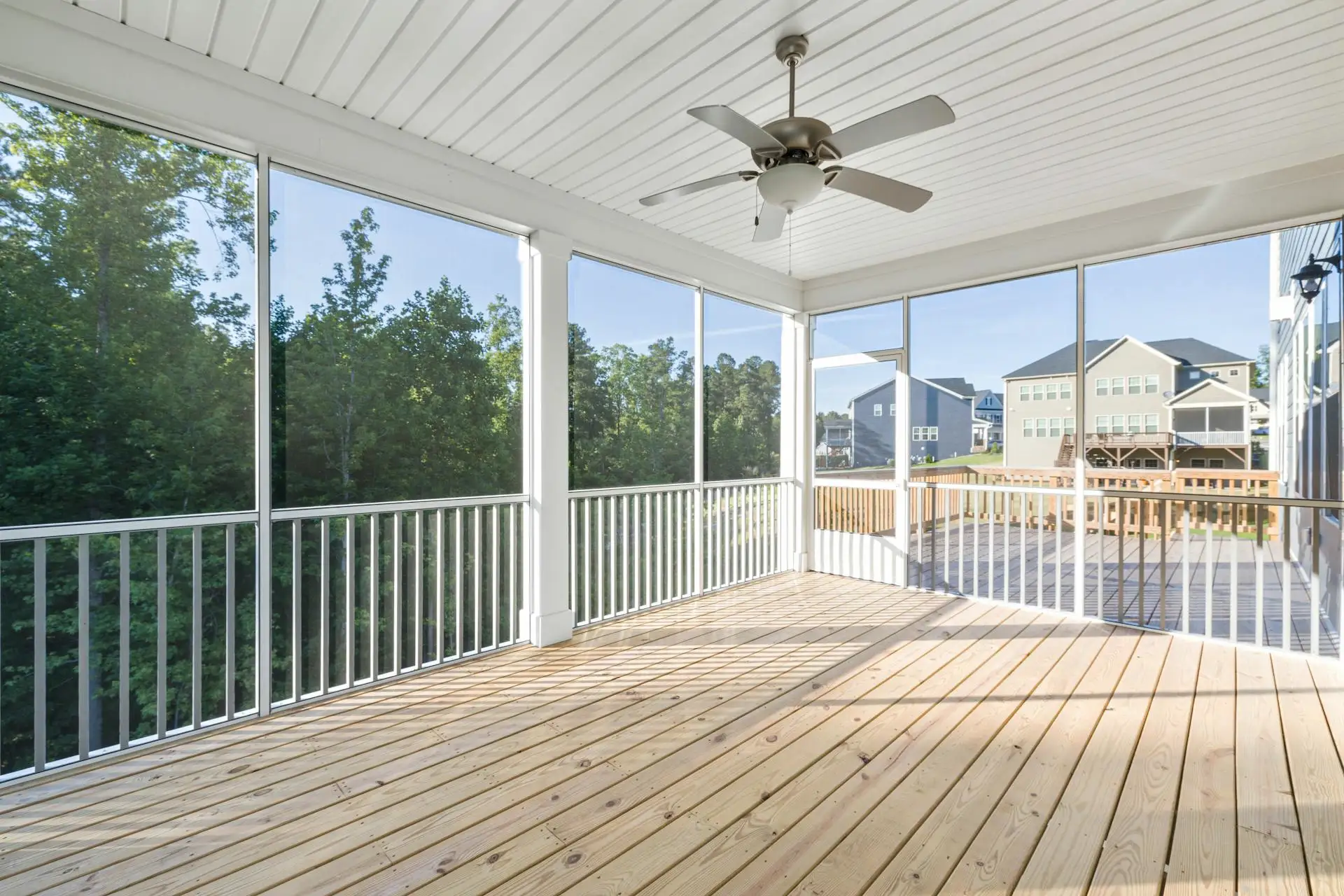 wooden deck with whit rail